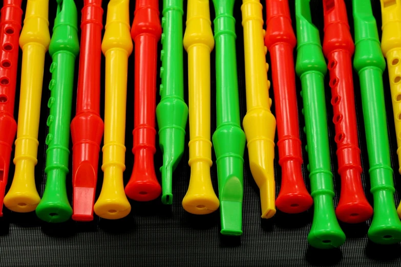 a close up of a bunch of musical instruments, inspired by Emanuel Büchel, flickr, plasticien, red green yellow color scheme, hp mp stamina bars, bones joints, colors of jamaica