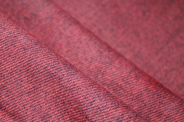 a close up of a piece of red fabric, unsplash, red and blue garments, grain”, img _ 9 7 5. raw, red shirt