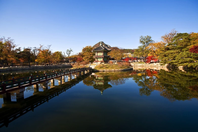 a bridge over a body of water surrounded by trees, a picture, by Simon Gaon, shutterstock, shin hanga, korean traditional palace, stock photo