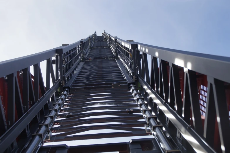 a metal ladder going up into the sky, by Jakob Gauermann, shutterstock, cinematic view from lower angle, opposite the lift-shaft, fire, high details photo