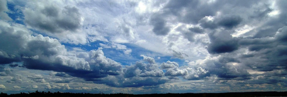 a large body of water under a cloudy sky, a picture, flickr, romanticism, tattoos of cumulus clouds, weather report, in forcasted sky, on clouds