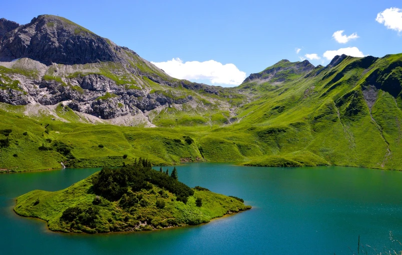 a small island in the middle of a lake, by Werner Andermatt, renaissance, shades of green, alp, wikimedia, gorgeous view