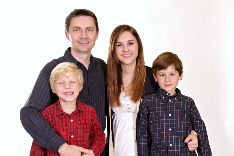 a man, woman and two children posing for a picture, a picture, headshot profile picture, tomasz strzalkowski, catalog photo, ryan meinerding