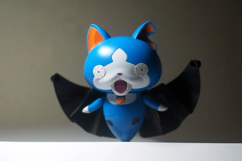 a close up of a figurine of a cat, a picture, by Shigeru Aoki, flickr, neo-dada, one blue ) and huge bat ears, cutecore clowncore, action figurine toy, doraemon