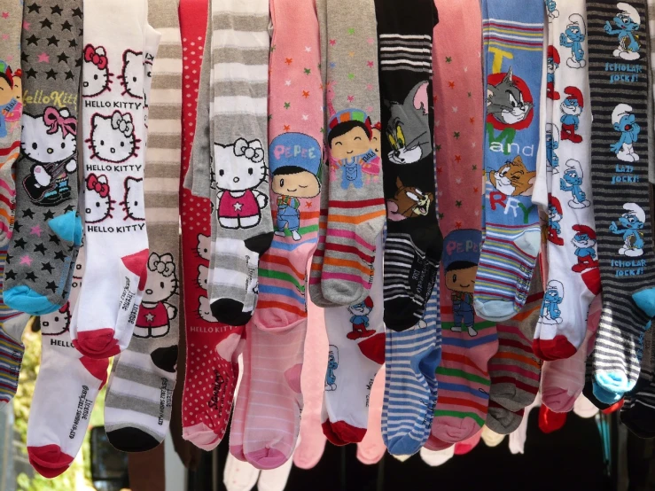 a bunch of socks hanging next to each other, by Murakami, flickr, toyism, hello kitty, harajuku street fashion, california;, detailed cartoon