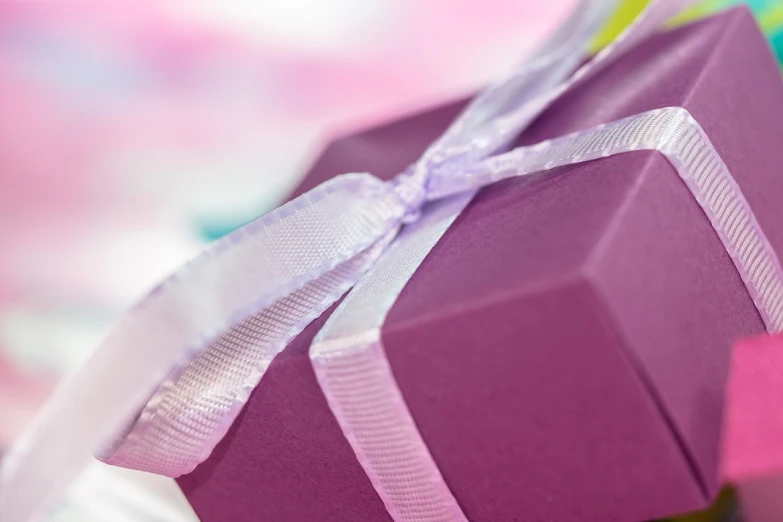 a purple gift box with a white ribbon, by Anna Haifisch, pixabay contest winner, happening, close - up profile, close up angle, happy birthday, a close up shot