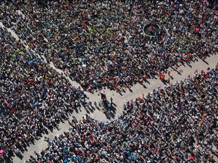 an aerial view of a large crowd of people, a photo, by Giovanni Pelliccioli, big!!!!!!!!!!!!, shot on nikon d 3 2 0 0, pareidolia, first place