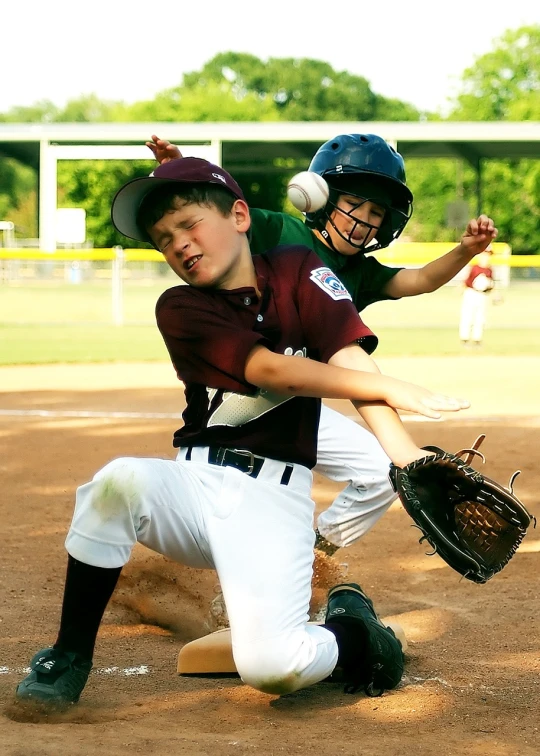 a couple of kids playing a game of baseball, a photo, by Scott M. Fischer, flickr, chest guard, maroon, struggling, florida