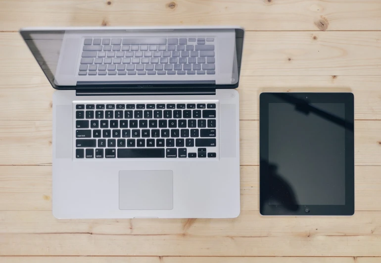 an open laptop computer sitting on top of a wooden table, a portrait, by Romain brook, pixabay, bottom angle, took on ipad, white background”, shot from above