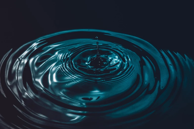 a water drop in the middle of a body of water, pexels, renaissance, rippling electromagnetic, stock photo, water running down the walls, stunningly detailed