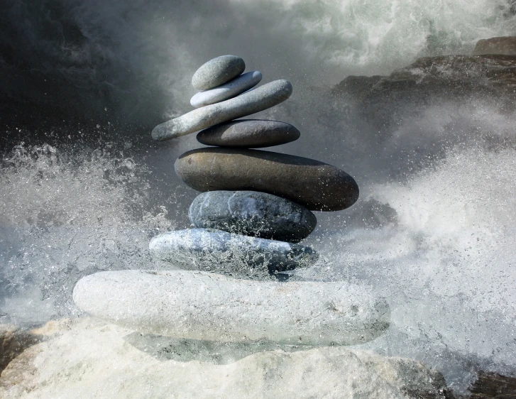 a stack of rocks sitting on top of a body of water, a digital rendering, inspired by Kaigetsudō Ando, pexels, turbulent waves, sculpture made of water, balancing the equation, sea spray