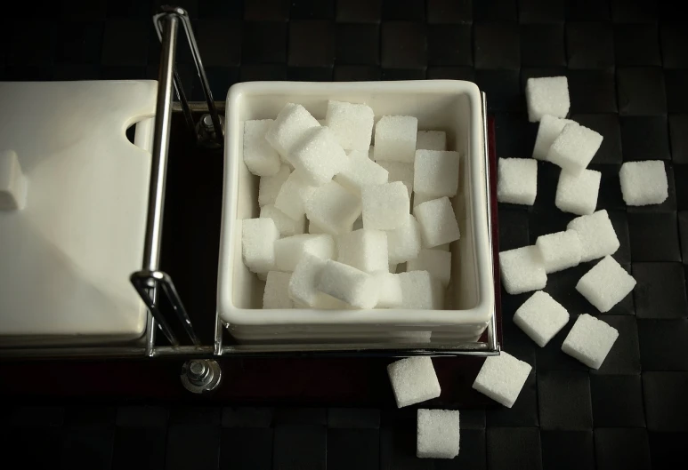 a bowl of sugar cubes next to a container of sugar cubes, by Hiroyuki Tajima, flickr, square, toast, cart, lot of foam