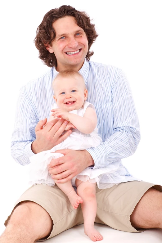 a man sitting on the ground holding a baby, with a white background, istockphoto, daughter, very very happy!