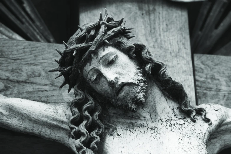 a close up of a statue of jesus on a cross, by Jan Kupecký, fine art, b&w photo, istock, crown of thorns, taken in 1 9 9 7