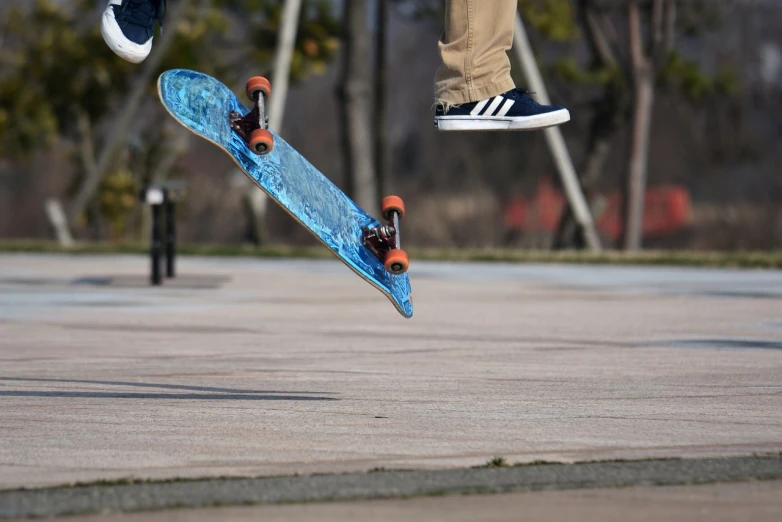 a man flying through the air while riding a skateboard, a picture, closeup shot, at the park, [ floating ]!!, february)
