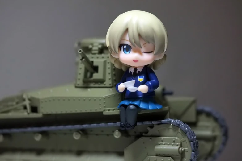 a figurine of a woman sitting on top of a tank, inspired by Li Chevalier, flickr, nendoroid, seifuku, model エリサヘス s from acquamodels, blonde girl