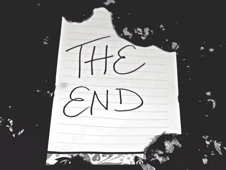a piece of paper with the end written on it, a poster, tumblr, black and white artistic photo, the end of the word, horror movie poster style, 🪔 🎨;🌞🌄
