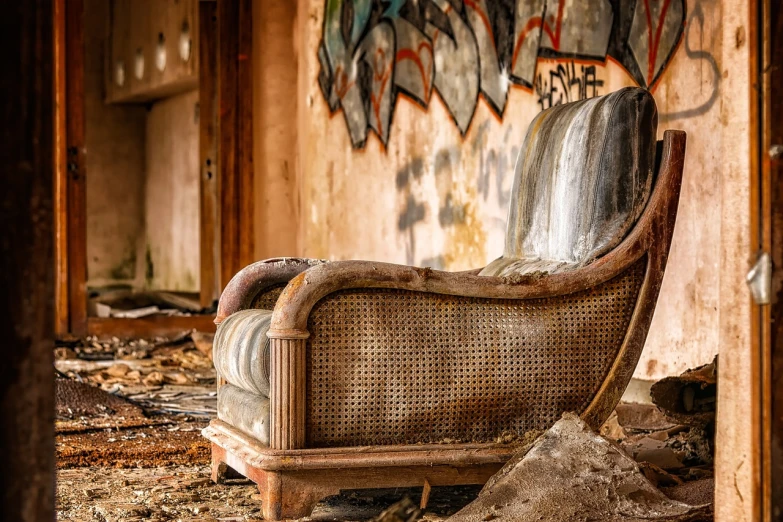 a chair in an abandoned building with graffiti on the wall, by Carl Rahl, pexels, lounging on expensive sofa, wicker chair, destroyed, portrait!!!!