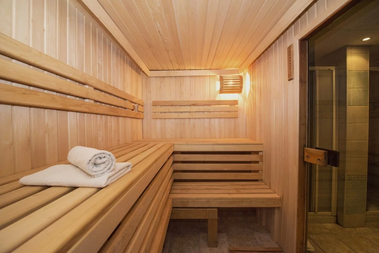 a wooden sauna room with a towel on the bench, shutterstock, фото девушка курит, high quality photos, birch, located in hajibektash complex