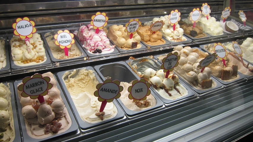 a display case filled with lots of different types of ice cream, by Aleksander Kotsis, flickr, renaissance, ibiza, caramel, hot summer sun, cut-away