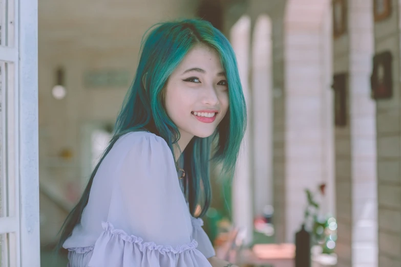 a woman with blue hair posing for a picture, inspired by Lü Ji, tumblr, wearing green clothing, beautiful smiling face, xianxia, young and cute girl