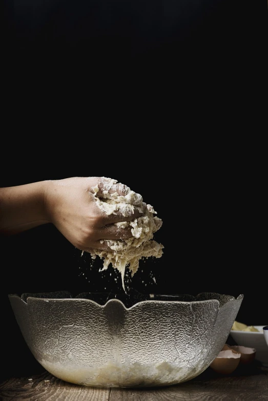 a person is sprinkling flour into a bowl, by Adam Chmielowski, ++++ super veiny hands, bust, melting cheese, 1 0 0 0 mm