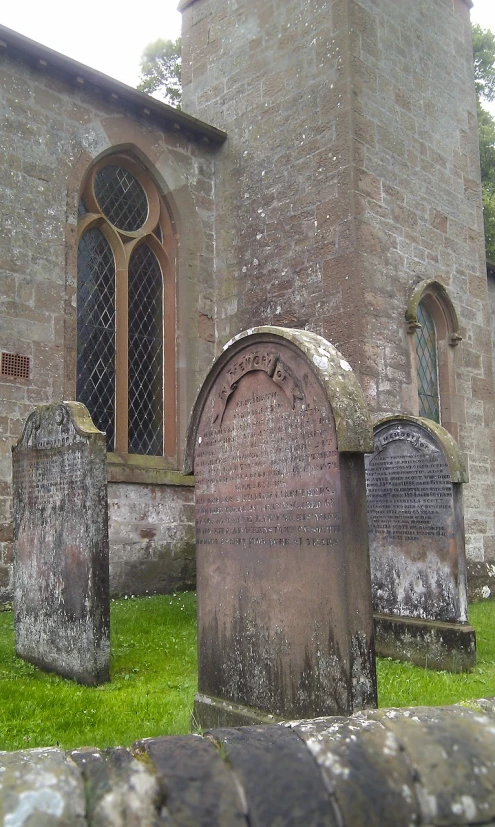 a group of tombstones in front of a church, by Edward Clark, flickr, renaissance, stone runes on the front, view from the side”, shap, copper