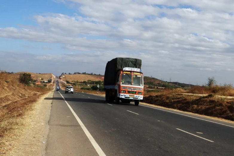 a truck that is sitting on the side of a road, flickr, samikshavad, fully covered, 1km tall, moving forward, very sparse detail