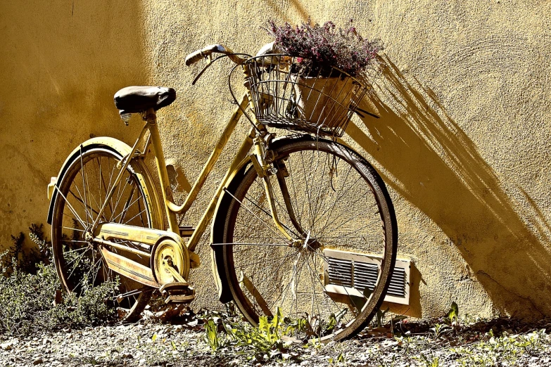 a yellow bicycle leaning against a yellow wall, a picture, pixabay contest winner, renaissance, sepia sunshine, lavander and yellow color scheme, photorealism. trending on flickr, flower power