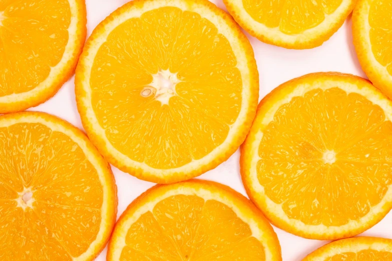 a group of orange slices sitting on top of each other, a picture, pexels, 🦩🪐🐞👩🏻🦳, background image, wide screenshot, yellow aureole