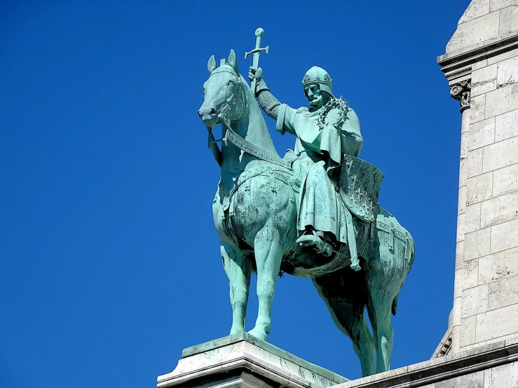 a statue of a man on a horse on top of a building, by Viktor de Jeney, figuration libre, green cape, pope, cyan, budapest