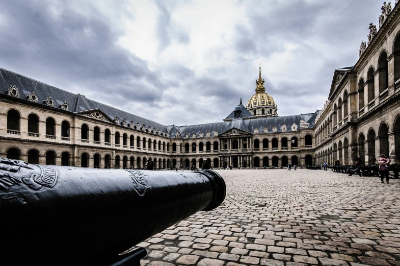 a cannon sitting in the middle of a courtyard, by Raphaël Collin, pixabay, baroque, unsplash photo contest winner, monumental giant palace, jean - baptiste belin, terminal