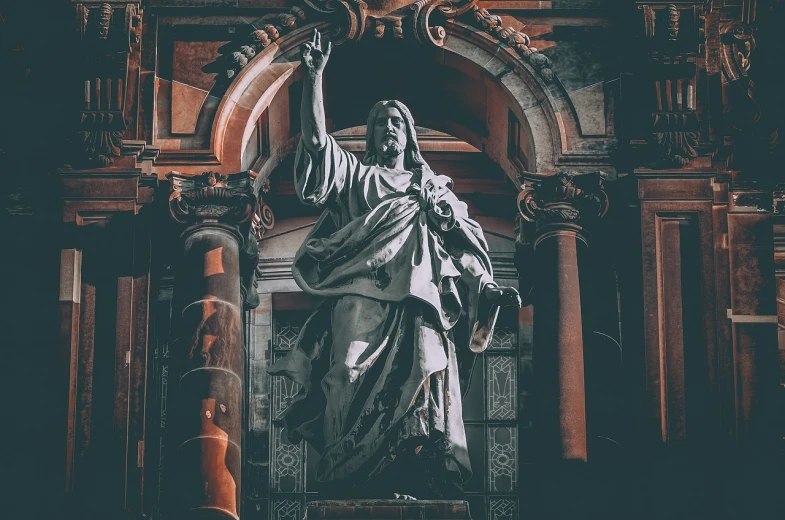 a statue of jesus in front of a building, by Matija Jama, pexels, baroque, on a dark background, waving, in an ancient altar, photo pinterest