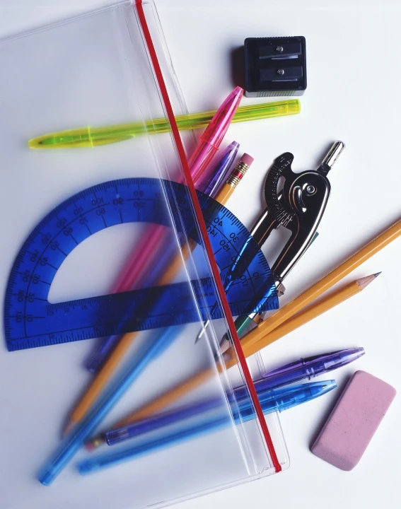 a variety of school supplies laid out on a table, by Aleksander Gierymski, 7 0 mm. digital art, 1 0 2 4 x 7 6 8, high - tech, arcs