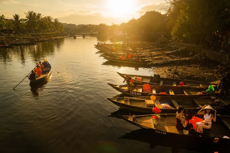 a number of small boats in a body of water, a picture, by Matt Stewart, pexels contest winner, sumatraism, sunlight reflected on the river, istock, old dhaka, warm glow