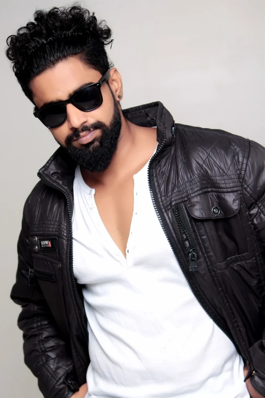 a man wearing a leather jacket and sunglasses, inspired by Manjit Bawa, hurufiyya, shaggy, modeling, without background, brook