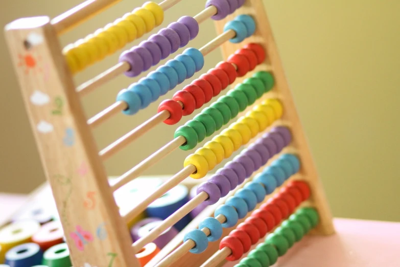 a wooden abacuse sitting on top of a table, by Ella Guru, pixabay, maths, beads, rack, colorful computer screen