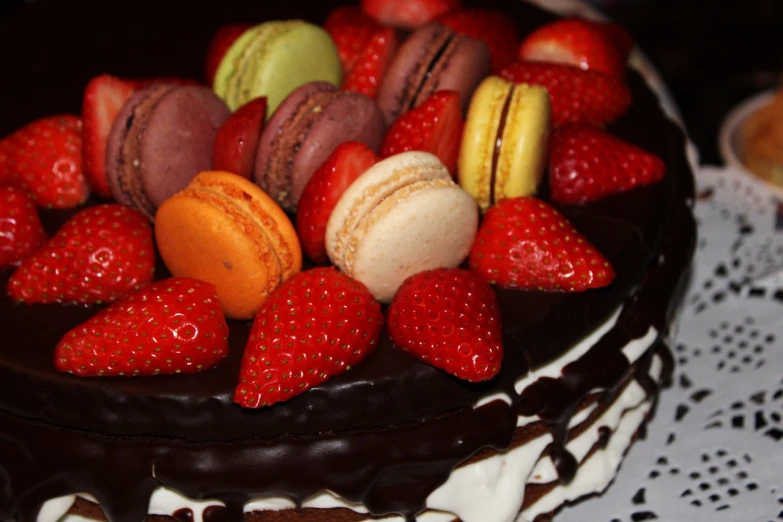 a chocolate cake topped with strawberries and macarons, romanticism, multi colour, taken with a pentax k1000, detailed zoom photo, 6 4 0