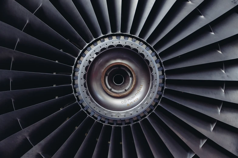 a close up view of a jet engine, by Matt Stewart, pexels contest winner, renaissance, four wings, blank, background, titanium