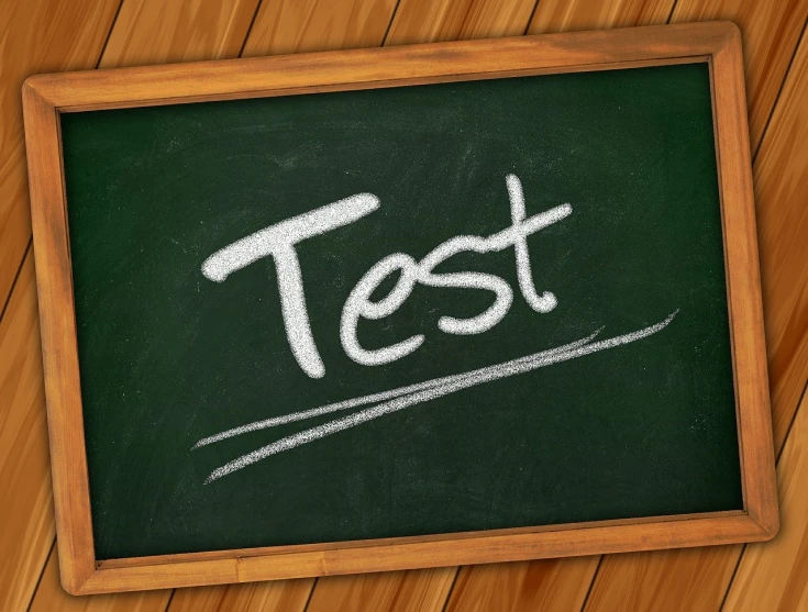 a chalkboard with the word test written on it, a picture, trending on pixabay, storyboarding, romanian, tent, diagnostics