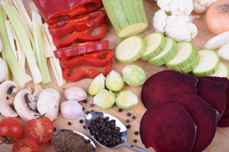 a wooden cutting board topped with different types of vegetables, by Aleksander Gierymski, pixabay, bottom viev, sparkling, reddish, high res photo