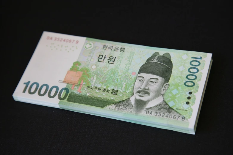 a bank note with a picture of a man on it, by Kim Eung-hwan, worth 1 0 0 0. com, three quater notes, hanbok, stacks