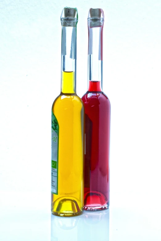 a couple of bottles of wine sitting next to each other, a picture, by Jan Rustem, dau-al-set, cooking oil, colored accurately, bottom - view, clear color