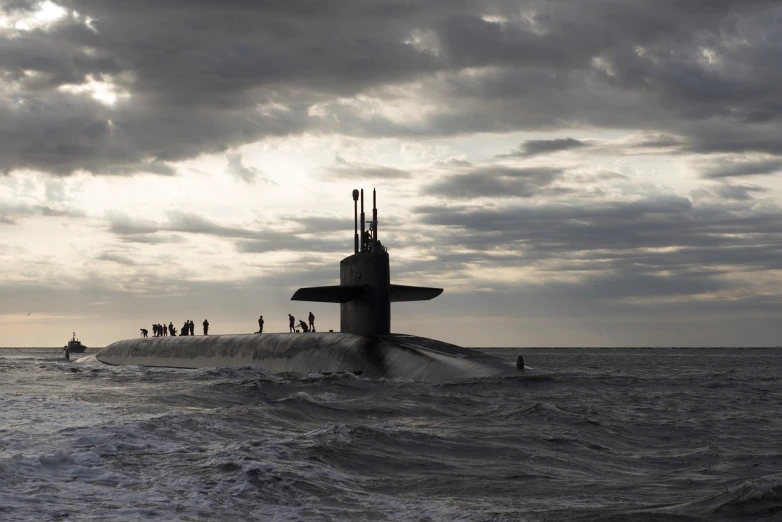 a submarine in the middle of the ocean, a portrait, by John Murdoch, shutterstock, siluettes, icbm, at dusk, pentagon