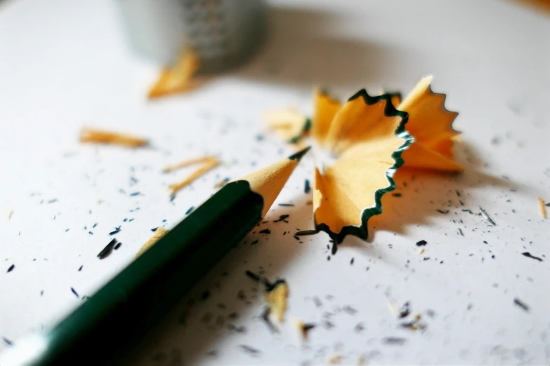 a close up of a pencil on a table, by Niko Henrichon, shattering expectations, istockphoto, photo - realistic wallpaper, photo realistic