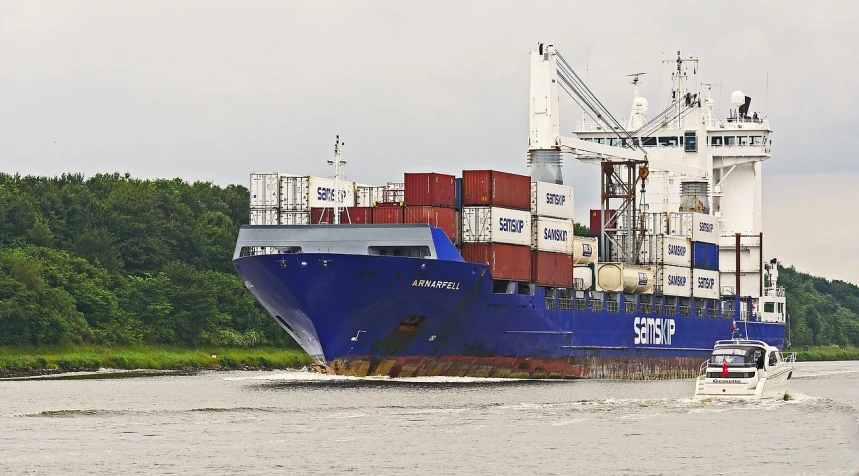 a large boat traveling down a river next to a forest, by Sven Erixson, pixabay, container ship, avatar image, portrait n - 9, savannah