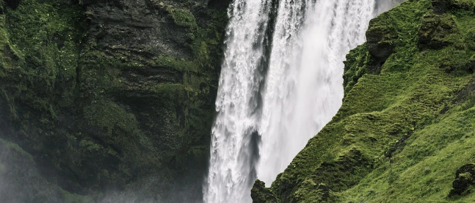 a group of people standing in front of a waterfall, by Alexander Bogen, unsplash contest winner, hurufiyya, 4 k detail, extremely high detail, portrait of tall, huge waterfall