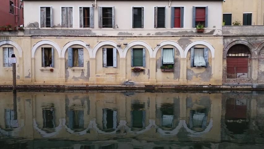 a building next to a body of water, pixabay, renaissance, windows and walls :5, barbara canepa, reflexes, studio ghiblo
