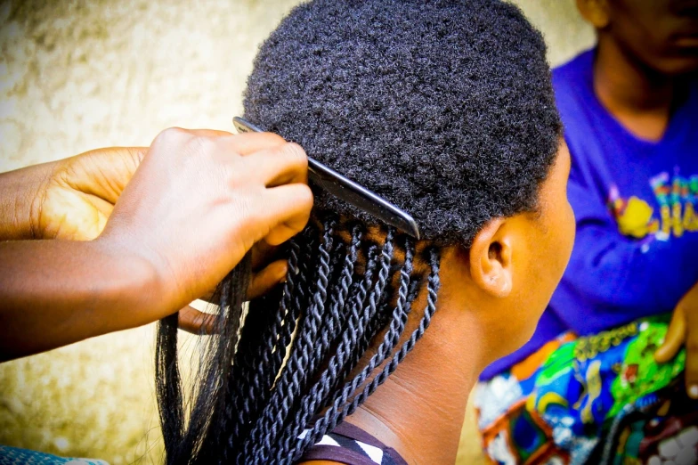 a person cutting another person's hair with a comb, by Adam Manyoki, plasticien, black hair in braids, photo pinterest, covered!! hair, vine twist