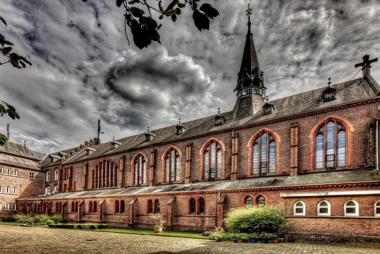 a large brick building with a clock tower, a photo, by Thomas Häfner, pixabay, alien church, tonemapped, school courtyard, eldenring
